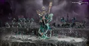 Fictional battle scene featuring a large skeletal warrior with mechanical limbs and a glowing staff on the left. Surrounding it are smaller skeletal figures with spears and shields, some mounted on skeletal steeds. A rocky battlefield with mist and distant ruins in the background.