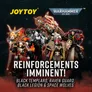 A dark background with a group of seven detailed action figures in the center, each wearing ornate armor with skull motifs, capes, and weapons. The figures are arranged in a dynamic pose. At the top, the text "JOYTOY" in yellow and "WARHAMMER 40,000" in white with a blue and silver logo. Below the figures, the text "REINFORCEMENTS IMMINENT!" in large white letters, followed by "BLACK TEMPLARS, RAVEN GUARD, BLACK LEGION & SPACE WOLVES" in smaller white text.