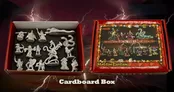 A red cardboard box labeled "Adventures in the Upside-Down" features colorful artwork depicting various fantasy miniatures, including characters and creatures. Next to it, an open box reveals a collection of 14 unpainted miniatures, including a Demogorgon and other figures, arranged on a black foam insert. The background has a dark, stormy theme with lightning effects, enhancing the fantasy atmosphere.