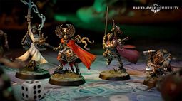 A trio of miniatures from the board game Warhammer Quest: Darkwater is displayed on a detailed game board. On the left, a character in a flowing red cloak wields a staff, while in the center, a heavily armored warrior brandishes a sword and shield, showcasing intricate details on their armor. To the right, a duardin ranger holds an axe and has a backpack filled with adventuring gear, all set against a richly colored background that enhances the fantasy theme.