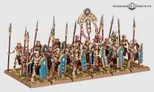 Miniature models of six skeleton chariots with detailed Nehekharan designs, each pulled by two skeletal horses. Chariots carry two skeletal warriors with spears and shields. Background shows skeletal warriors and archers in varied poses, some holding spears, others bows.
