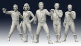 Five sci-fi miniatures are displayed, representing Galactic Explorers. Each figure is in a dynamic pose, with two holding futuristic weapons and the others in various stances suggesting action or readiness. The miniatures are detailed, featuring sleek, form-fitting suits and distinct hairstyles, all rendered in a light gray color that highlights their features. The background is a gradient from dark to light, emphasizing the figures.
