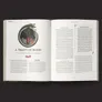 An open book displays two pages featuring the chapter titled "A Treaty of Blood." The left page includes an illustration of a fierce, black creature with sharp teeth and a red orb in its mouth, framed by a decorative circular border. The right page contains text detailing the background of the mystery, with headings and paragraphs formatted for easy reading. The overall design is elegant, with a dark background that enhances the visual elements.