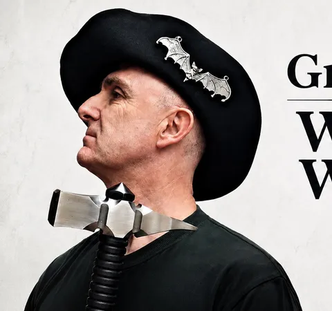 Person wearing a black hat with bat decorations, text "Graeme When We Were Made of Flint"