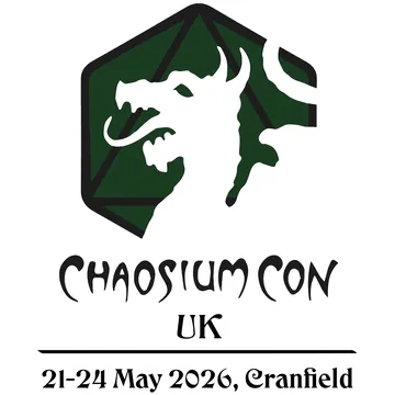 A logo for Chaosium Con UK features a stylized dragon's head in white, set against a dark green hexagonal background with a geometric design. Below the dragon, the text "CHAOSIUM CON" is prominently displayed in a bold, artistic font, with "UK" beneath it. The dates "21-24 May 2026" and the location "Cranfield" are included at the bottom in a simpler font.