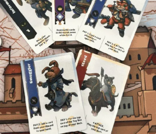 Assorted illustrated game cards with characters like Smuggler, Steed, and a rabbit warrior on a fantasy map.