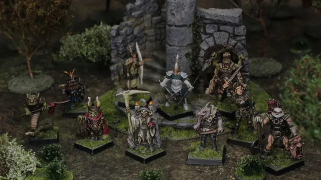 A group of intricately detailed fantasy miniatures stands in a lush, green setting near a stone ruin. The figures include various characters such as a skeletal leader holding a staff, a warrior with a bow, and a creature resembling a humanoid animal, all showcasing vibrant colors and classic 80s-style designs. Surrounding them are patches of grass and small bushes, enhancing the scene's immersive tabletop atmosphere.