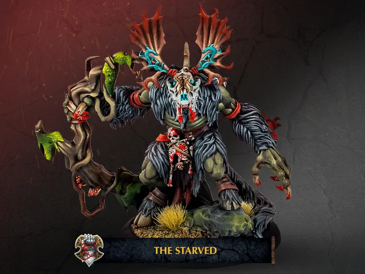 A large, menacing creature known as The Starved stands prominently, featuring a skeletal face adorned with a skull and antlers, and a body covered in dark fur and tattered clothing. It wields a twisted staff entwined with green vines, while a small figure is clutched in its grasp, adding to its intimidating presence. The base is decorated with grass and rocks, set against a dark, textured background that enhances the creature's ominous appearance.