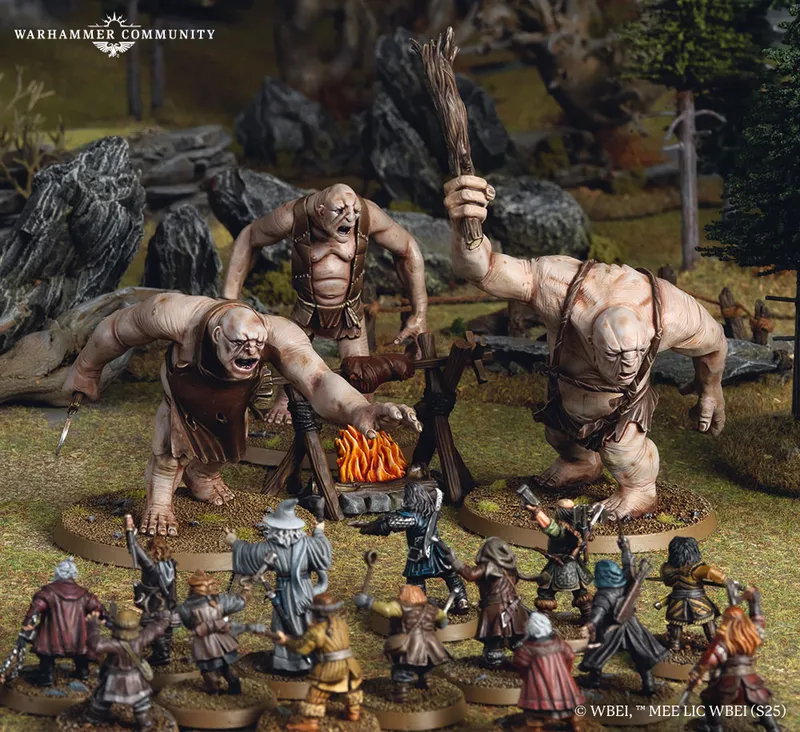 Three large trolls, each with distinct features and wielding makeshift weapons, are positioned around a campfire in a forested setting. In the foreground, a group of characters from Thorin's Company, including dwarves and a wizard, are depicted in various poses, preparing for confrontation. The scene captures the tension of the moment, with detailed terrain elements like rocks and trees enhancing the atmosphere.