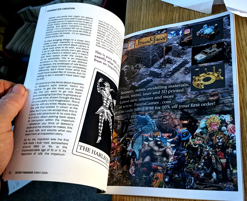 A hand holds open a page from the publication "Secret Passages," revealing text discussing character creation in the context of the game "Inquisitor." On the left side, there is an illustration of a character labeled "The Harlequin," depicted in a stylized, jester-like costume. The right side features an advertisement for Fenris Games, showcasing a variety of miniatures and scenery, with vibrant colors and intricate details. The background suggests a cozy indoor setting, with a wooden table surface visible.