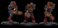 Three intricately designed miniatures stand against a black background, showcasing a futuristic aesthetic. Each figure features a robust build with prominent red and blue armor, detailed mechanical components, and unique weaponry, including a large, cylindrical device and a smaller, handheld weapon. The bases are textured to resemble rocky terrain, enhancing the overall sci-fi theme of the miniatures.