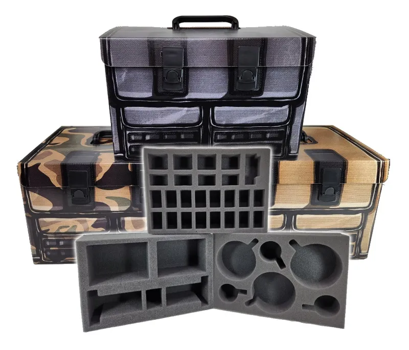 Open hard-shell case with a camouflage pattern exterior. The case has a black handle on top and two black latches on the front. Inside, the lid features a mesh pocket with a zipper and two elastic loops. Below the lid, the base of the case contains customizable gray foam inserts. The top layer of foam has cutouts in various shapes and sizes, including rectangular slots, circular recesses, and smaller circular holes. The middle foam layer has rectangular compartments arranged in rows. The bottom foam layer has larger rectangular cutouts. No text is visible.