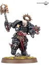 A Black Templars Execrator stands in a dynamic pose, wielding a large, ornate power hammer in one hand and a pyre pistol in the other. The figure is clad in black armor adorned with gold and silver details, including a skull motif on the helmet and a purity seal on the chest. The base features a grassy terrain with scattered skulls, enhancing the grim aesthetic typical of the Warhammer 40,000 universe.