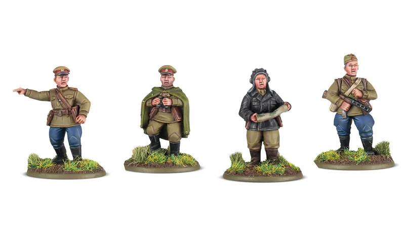 Four 28mm scale miniatures are displayed, featuring various military figures. On the left, a Soviet officer in a green cloak holds binoculars, while next to him, a soldier in a brown uniform stands with a map. The figures are set on bases adorned with tufts of grass, enhancing the realistic appearance. Each miniature showcases detailed painting and distinct uniforms representative of their respective forces.