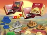 Catan game boxes, dice, and miniatures in Egypt, China, Greece, Germany styles.