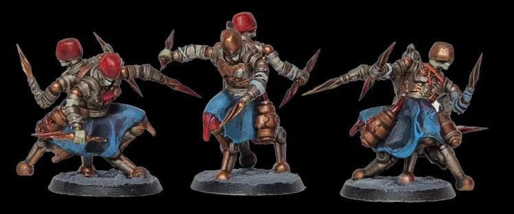 Two intricately designed miniatures from the game VoidSeige are displayed, showcasing a warrior in armor with a bronze finish and a blue tunic. Each figure is posed dynamically, holding a spear in one hand while the other arm is extended, suggesting movement. The miniatures are mounted on circular bases, with a textured surface that adds to their detailed appearance.