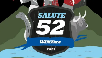A stylized graphic for Salute 52 features a central shield with the text "SALUTE 52" prominently displayed, flanked by the words "SOUTH LONDON WARLORDS" and the year "2025." Surrounding the shield are four characters: a warrior with a sword and shield, a bagpiper, a soldier in a red coat, and a woman with red hair and a blue mask. In the background, there are elements like a dinosaur and a Highland cow, set against a dramatic sky with lightning. The bottom of the image includes the phrase, "There can be only one day of SALUTE!"