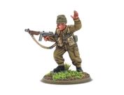 A detailed miniature of a soldier in a military uniform, standing on a circular base adorned with grass and dirt. The figure, representing Augustus Newman VC, is depicted in a dynamic pose, holding a submachine gun in one hand while raising the other in a commanding gesture. He wears a green beret and a khaki uniform, complete with various pouches and gear attached to his chest.
