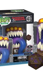 A Funko POP collectible features a Dungeons and Dragons Mimic designed as a treasure chest with a wide, gaping mouth filled with sharp teeth and a long, purple tongue. The Mimic is brightly colored, with orange accents on top, and is accompanied by a D20 die in front, showcasing intricate designs. The packaging displays the Funko logo and the number "423," indicating its series.