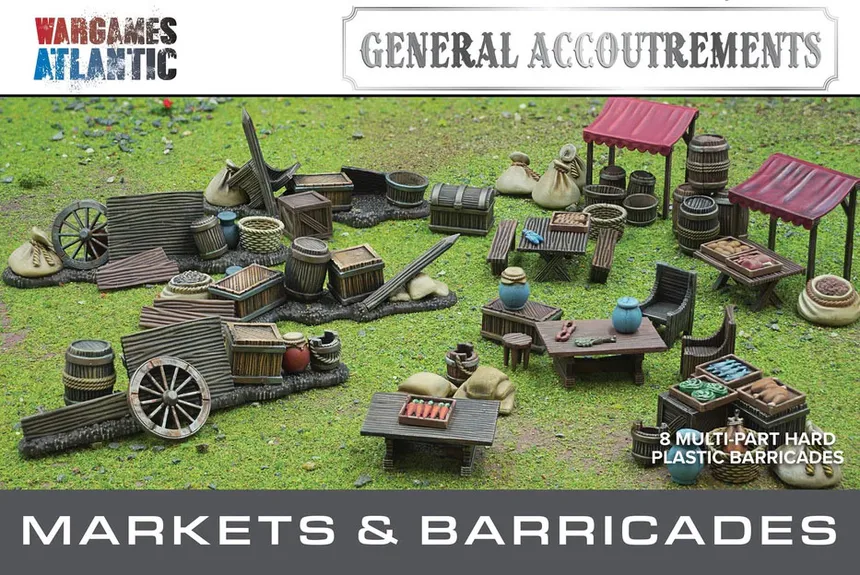 A detailed tabletop scene features a variety of marketplace elements, including wooden stalls, barrels, crates, and bags, all set on a grassy surface. The scene showcases multiple tables with assorted food items and decorative pieces, emphasizing the bustling atmosphere of a market. Above the scene, the text "GENERAL ACCOUTREMENTS" and "MARKETS & BARRICADES" is prominently displayed, indicating the theme of the set.