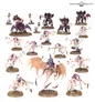 A diverse array of Warhammer miniatures is displayed, featuring various Tyranid models in shades of purple and pink. The collection includes several distinct figures such as a large creature with wings, smaller alien-like beings, and a mix of infantry and monstrous units, all set on textured bases. The background is plain, allowing the vibrant colors and intricate details of the miniatures to stand out prominently.