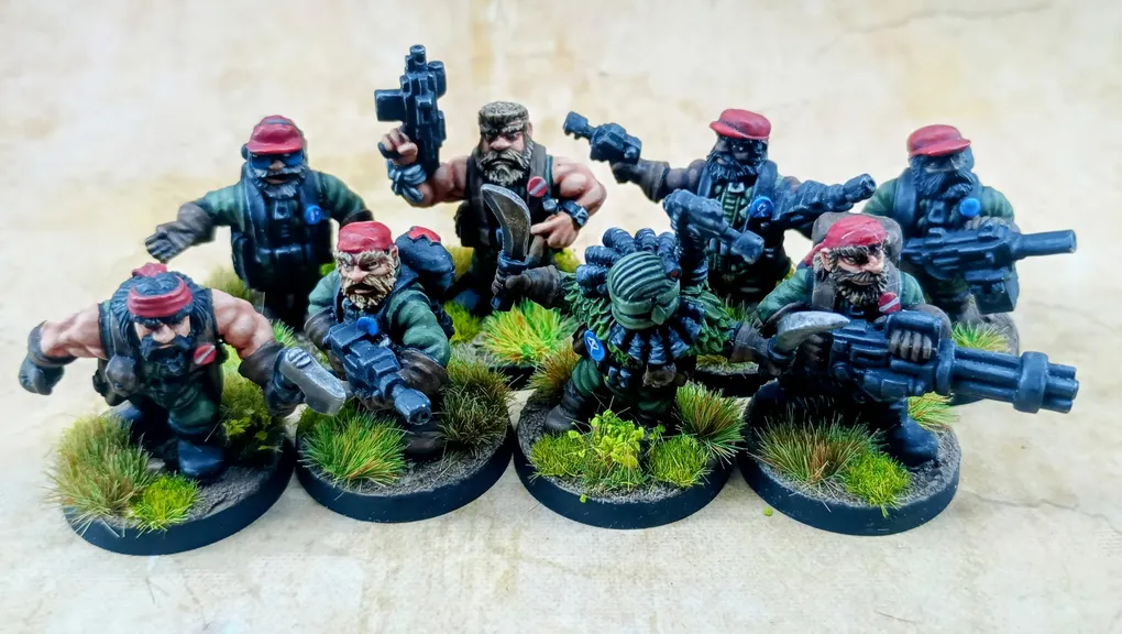 A group of eight intricately detailed miniatures representing space dwarves in a jungle setting, each standing on circular bases adorned with tufts of grass. The figures are dressed in military-style attire, featuring green clothing and red caps, with various weapons including guns and a curved blade. Their expressions are fierce and determined, showcasing a blend of ruggedness and character typical of old-school metal miniatures.