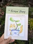Book cover: "the Bonsai Diary" with illustrated cat in a pot, tree, and butterfly.
