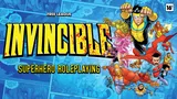 Large, bold, yellow and black splattered letters spelling "INVINCIBLE" dominate the top left. Below it, black text reads "HERO ROLEPLAYING" in a similar style. In the top left corner, smaller white text says "FREE LEAGUE."

On the right side, a group of stylized cartoon superheroes in colorful costumes are in mid-action. One blonde male in a yellow and blue suit appears to be flying or leaping forward with fists raised. A muscular male in an orange and blue suit with a smirk is also airborne. A female with pink hair in a purple and pink outfit is crouched, holding her hands out with energy effects. Another male in a green and purple outfit is in the background, mid-motion. Several speech bubbles contain text: one near the blonde male reads, "I KILLED YOU ONCE! I CAN DO IT AGAIN!!", another near the pink-haired female reads, "GOT HIM! GUYS THIS IS NO EXPERT!", and a third near the orange-suited male says, "HEY...HEY!" The background features a cityscape with