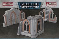 Two pieces of Gothic Sector terrain are displayed, featuring ruined structures with a weathered stone appearance. Each piece has arched windows and doors, accented with orange detailing, showcasing a mix of gray tones and visible wear. The terrain is designed for 28-35mm scale tabletop games, emphasizing its pre-painted, ready-to-use quality.