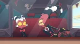 Two cartoon characters in a dimly lit, red-lit room. Left: a white-furred, pink-eyed cat in a black suit with a red bowtie. Right: a large, grinning pink monster with sharp teeth and a black suit, holding a knife. A smaller, dark-suited figure lies on the floor, bleeding.
