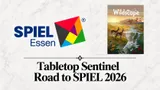 A geometric logo with the text "SPIEL Essen" in blue. Beside it, a game card titled "Wildscape" showing a landscape with two deer and a sunset. Below, the text reads "Tabletop Sentinel Road to SPIEL 2026."
