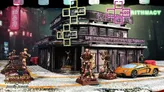 A cyberpunk building with "ALGO" signs, neon Chinese characters, and miniatures outside.