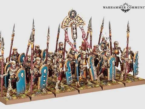 Miniature models of six skeleton chariots with detailed Nehekharan designs, each pulled by two skeletal horses. Chariots carry two skeletal warriors with spears and shields. Background shows skeletal warriors and archers in varied poses, some holding spears, others bows.