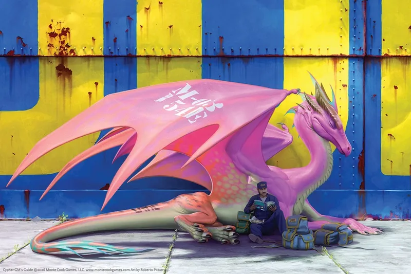 A man sitting beside a large pink dragon mural on a blue and yellow wall.