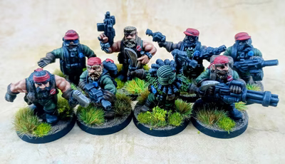 A group of eight intricately detailed miniatures representing space dwarves in a jungle setting, each standing on circular bases adorned with tufts of grass. The figures are dressed in military-style attire, featuring green clothing and red caps, with various weapons including guns and a curved blade. Their expressions are fierce and determined, showcasing a blend of ruggedness and character typical of old-school metal miniatures.