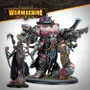 Exulon Nostilla, a Cephalyx psychic, stands on the left, adorned in dark robes with intricate mechanical details and glowing pink accents. Beside her is Aberration, a large, muscular monstrosity equipped with various mechanical enhancements and weapons, showcasing a mix of flesh and metal. Both figures are set against a neutral background, with the "WARMACHINE" logo prominently displayed at the top.