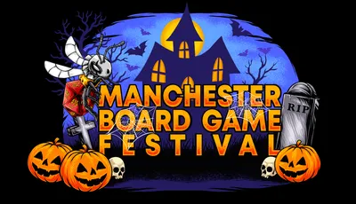A vibrant graphic features the text "MANCHESTER BOARD GAME FESTIVAL" prominently displayed in bold, orange letters against a dark, spooky backdrop. The scene includes a haunted house with glowing windows, bats flying in the night sky, and various Halloween-themed elements like pumpkins, skulls, and spider webs. The overall atmosphere is festive and eerie, perfectly capturing the Halloween spirit of the event.
