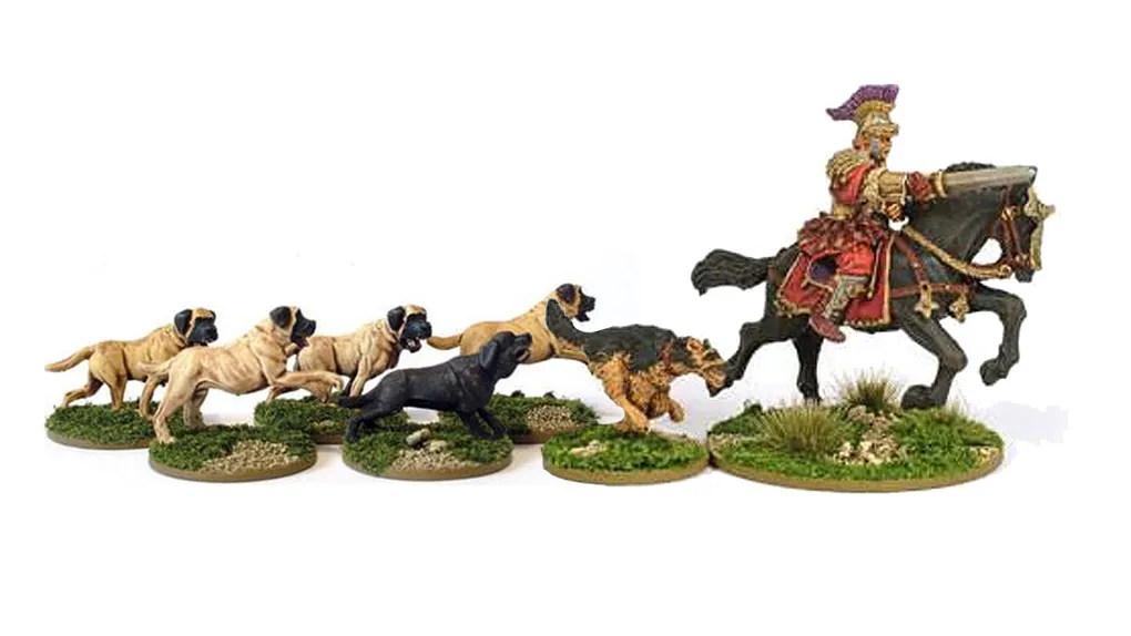 A collection of miniature dogs in various poses, including several tan and black dogs, is displayed on grassy bases. In the background, a mounted Roman general in ornate armor and a colorful plume rides a horse, adding a historical element to the scene. The dogs appear to be interacting with each other, creating a lively atmosphere around the general.