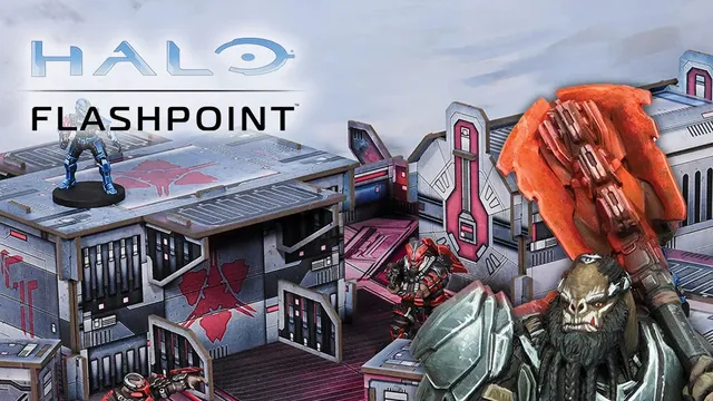 A detailed gaming scene from Halo: Flashpoint features a futuristic battlefield with intricately designed terrain and structures. In the foreground, a blue-armored character stands on a raised platform, while two red-armored figures engage in action nearby. The backdrop showcases a variety of buildings with sci-fi elements, emphasizing the game's immersive environment. The title "HALO FLASHPOINT" is prominently displayed at the top.