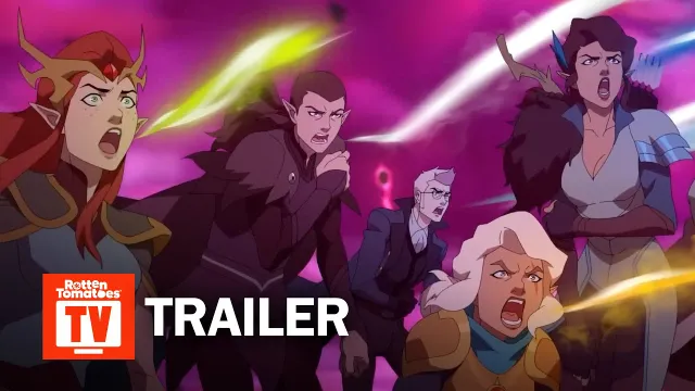 A group of animated characters from "The Legend of Vox Machina" is depicted in a dramatic scene, with expressions of concern and determination. The background features swirling pink and purple hues, suggesting a chaotic or magical environment. Prominently displayed in the foreground is the word "TRAILER," indicating the promotional nature of the image.