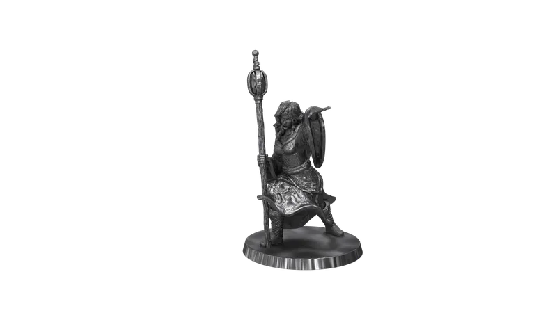 A winged figure holding a staff and shield on a round base.