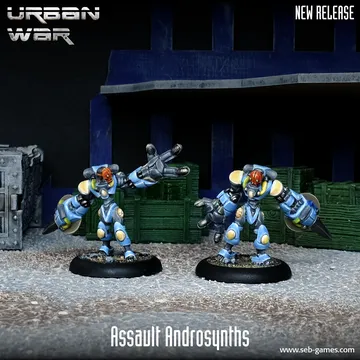 Two Assault Androsynth miniatures are prominently displayed in the foreground, designed for hand-to-hand combat. They feature a blue and yellow color scheme, with one holding a Vibro Scythe and the other a Cesti, showcasing their imposing, armored forms. The background includes dark crates and a textured surface, enhancing the urban warfare theme.