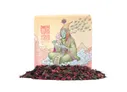 Tea packaging labeled "Void Blossom Green Tea" with a stylized illustration of a seated, green-skinned humanoid figure in ornate robes, holding a teacup. Surrounding text reads "MOW" and "Void Blossom." Scattered dried tea leaves below.