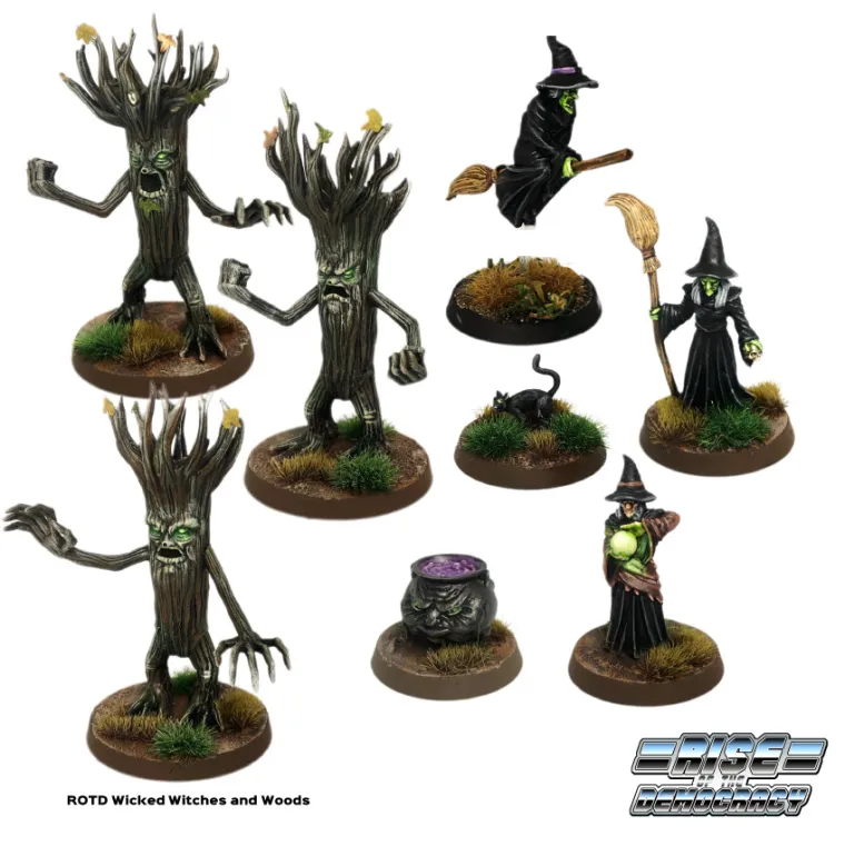 A collection of fantasy miniatures from the "Rise of the Democracy" series features various characters and creatures. Prominently displayed are several tree-like figures with expressive faces, alongside witches in dark robes, one holding a broomstick and another with a glowing orb. Additional elements include a cauldron, a black cat, and patches of grass on the bases, creating a whimsical yet eerie atmosphere.