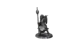 A winged figure holding a staff and shield on a round base.