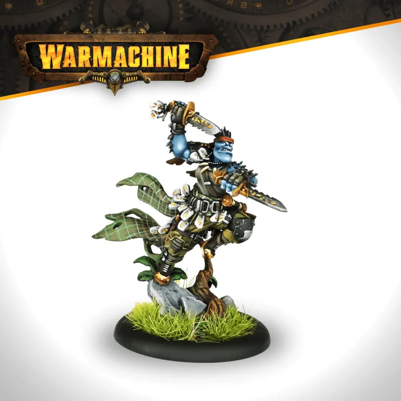 A trollkin warrior from the Southern Kriels Kithguard stands in a dynamic pose, brandishing a sword with a determined expression. He wears a mix of armor and tactical gear, featuring a green plaid cape and various pouches. The base is adorned with grass and a rock, emphasizing the character's connection to the jungle environment. The Warmachine logo is displayed prominently at the top of the image.